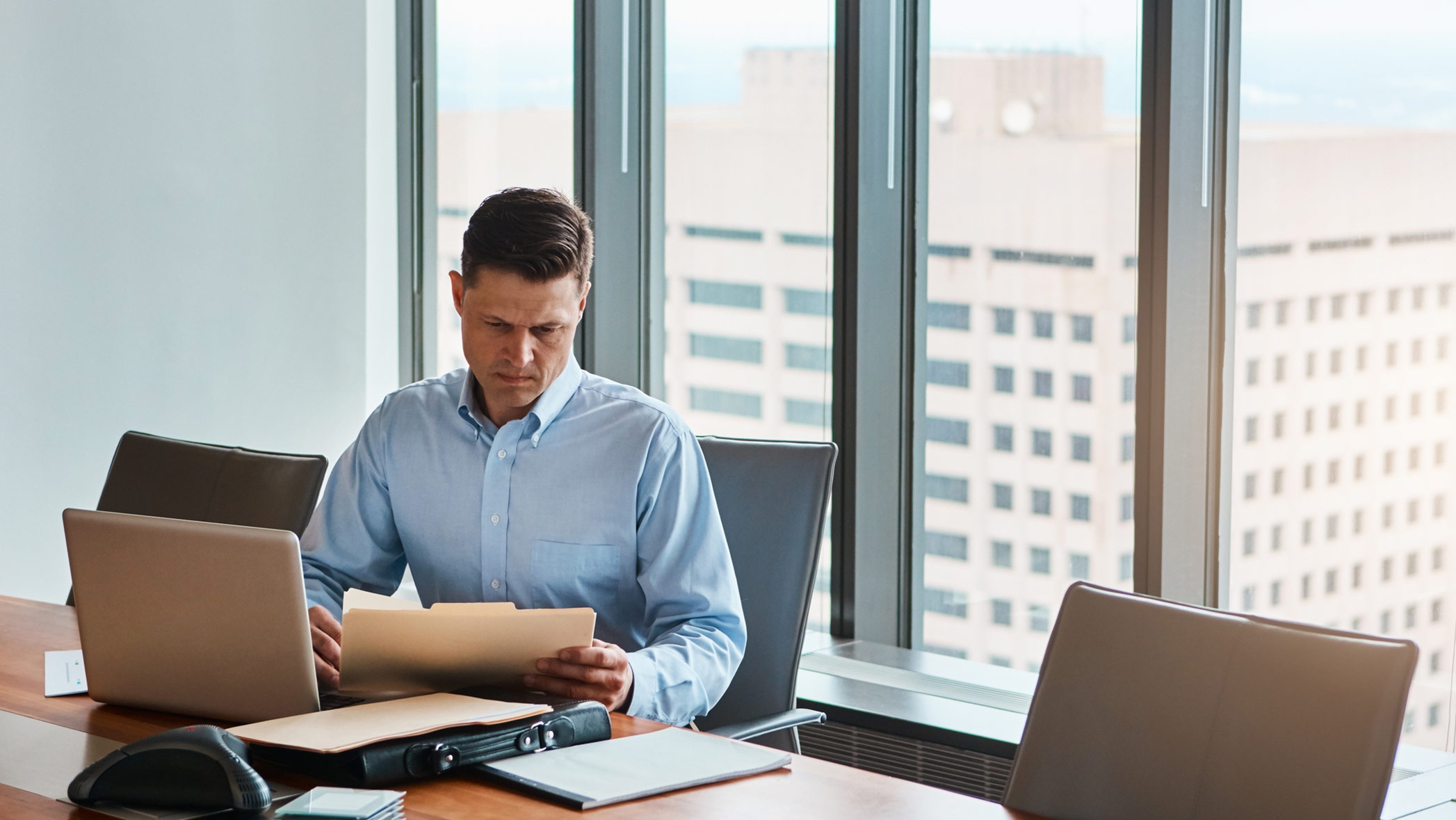 image of an attorney going through paperwork