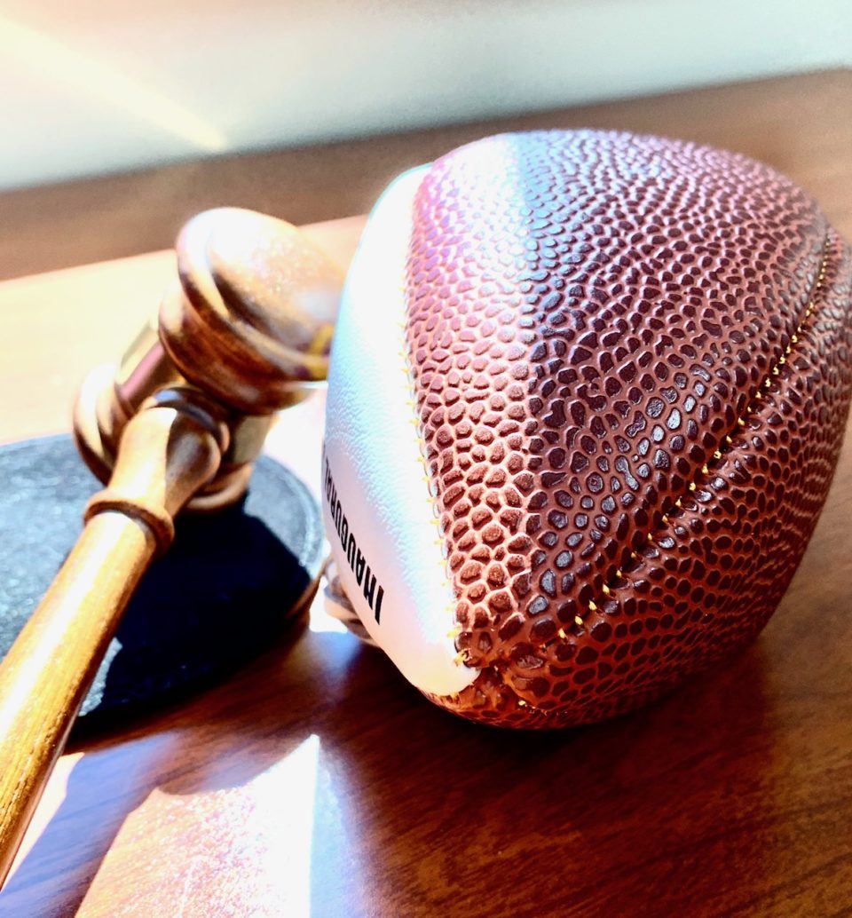 football sitting next to a gavel